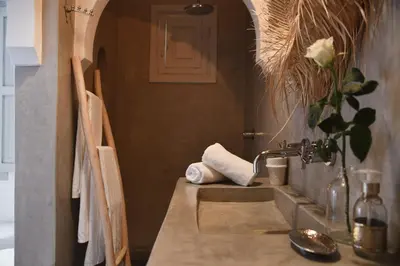 a bathroom with a sink with a faucet at Riad Nūr in Marrakech