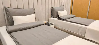 a room with two beds and pillows at Modern 2BR, Pool Access, Fast Wi-Fi in Marrakech