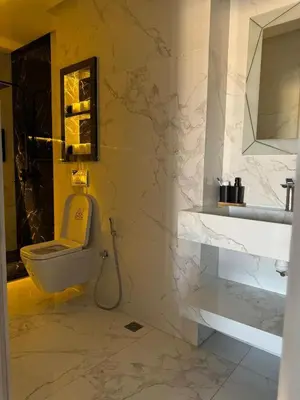 a bathroom with a toilet and a sink at Marrakech Riad in Marrakech