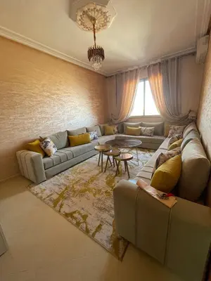 a living room with a couch and a table at Jasmine house in Marrakech in Marrakech
