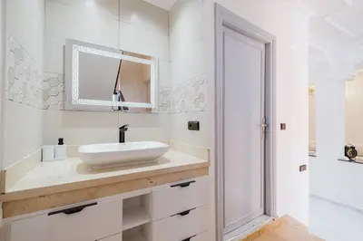 a white bathroom with a sink and a mirror at Villa 4 bedrooms with private pool in Marrakech in Marrakech