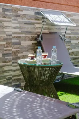 a table with water bottles on top of it at Villa 4 bedrooms with private pool in Marrakech in Marrakech