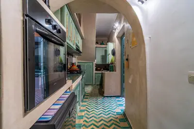 a hallway with a fish tank and a tv at Riad Dar Nana in Marrakech