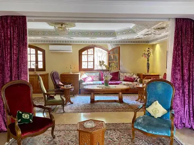 a large living room with a couch and chairs at Villa floor Espace ouvert in Marrakech
