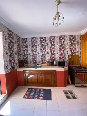 a kitchen with a counter and a stove at Villa floor Espace ouvert in Marrakech