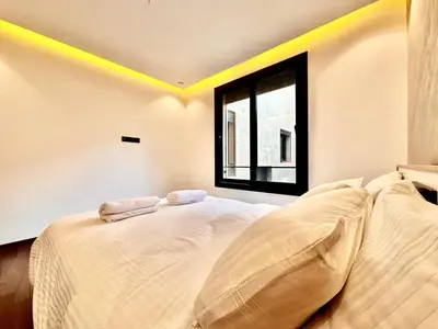 a bedroom with two beds and a window at Quiet & Cosy Apartment in Central Gueliz in Marrakech