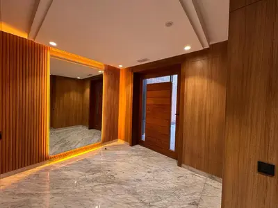a hallway with wood paneled walls and a mirror at Quiet & Cosy Apartment in Central Gueliz in Marrakech