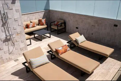 an overhead view of a patio with chairs and tables at Triplex De Luxe Ocra piscine privée in Marrakech