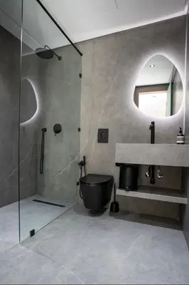a bathroom with a shower and a toilet and a sink at Triplex De Luxe Ocra piscine privée in Marrakech