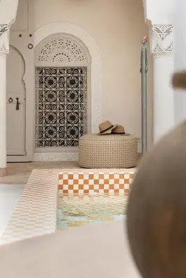 a view of a room with a door and a table with shoes at Riad Djannaat Exceptional private riad pool staff in Marrakech