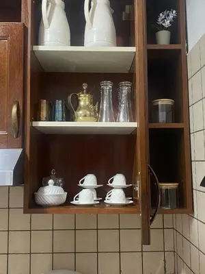 a cupboard with dishes and other items on it at Appartement en plein centre in Marrakech