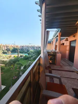 a balcony with a view of a city at Ennaim in Marrakech