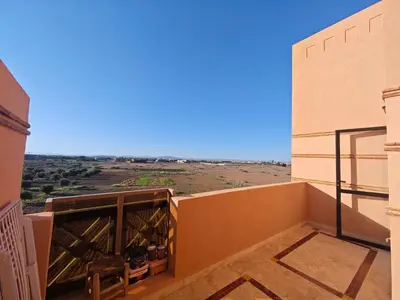 a balcony with a view of the desert at Ennaim in Marrakech