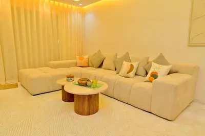 a living room with a couch and a coffee table at Luxury apartment with jaccuzi in Marrakech