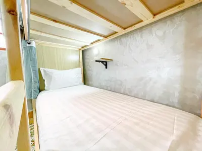 a small bedroom with a bed in a tiny house at Bubbly Hostel Marrakech in Marrakech