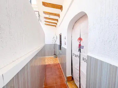 a hallway with a large door in a building at Bubbly Hostel Marrakech in Marrakech