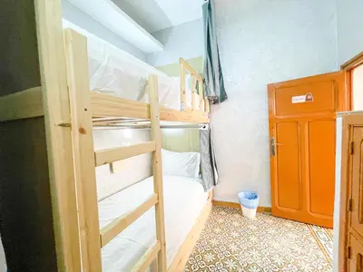 a bedroom with two bunk beds in a room at Bubbly Hostel Marrakech in Marrakech