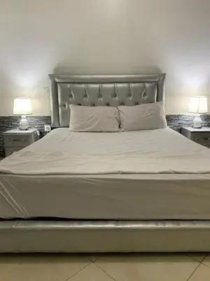 a bedroom with a large bed with two lamps at welcom to Marrakech in Marrakech