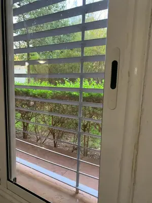 a window with blinds on a door with a view at welcom to Marrakech in Marrakech