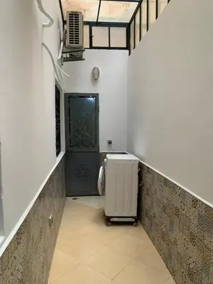 a hallway with a door and a heater in a room at welcom to Marrakech in Marrakech