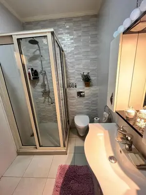 a bathroom with a shower and a toilet and a sink at Maison d'hôte Darkom Kech in Marrakech