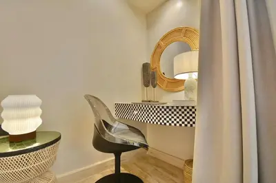 a room with a desk and a chair and a mirror at Central Luxury Quiet Hivernage 2 Balconies With View in Marrakech