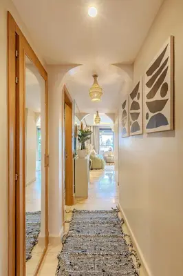 a hallway of a home with a rug at Central Luxury Quiet Hivernage 2 Balconies With View in Marrakech