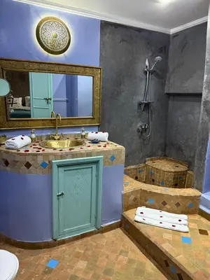 a bathroom with a sink and a shower and a tub at Riad medina d'or in Marrakech