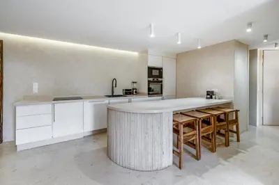 a kitchen with white cabinets and a white counter top at The view City Center in Marrakech