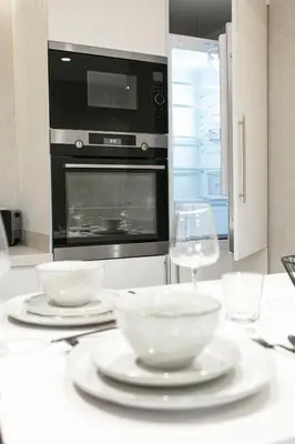 a kitchen with two bowls on a table with an oven at The view City Center in Marrakech