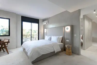 a bedroom with a large bed and a large window at The view City Center in Marrakech
