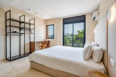 a bedroom with a large bed and a window at The view City Center in Marrakech