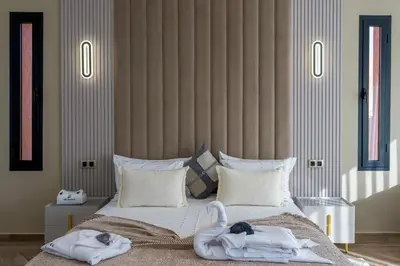 a bedroom with a bed with two swans on it at Villa Mareva & Spa Marrakech in Marrakech