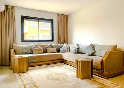 a living room with a couch and a window at Luxury Aprt 2-bedrooms-Pool Hivernage City Centre-Free Parking in Marrakech