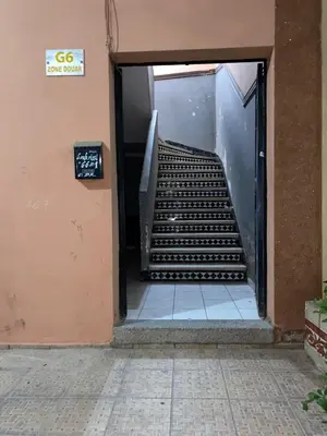 a staircase in a building with a stair case at Youssef House Le Village Touristique in Marrakech