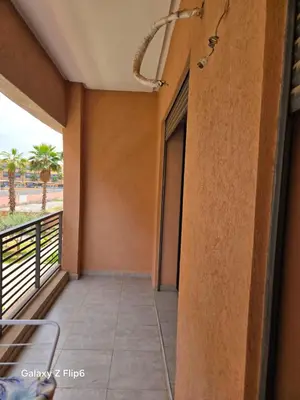 a corridor of a building with a balcony at APPARTEMENT à TARGA in Marrakech