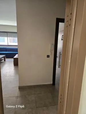 a hallway with a door leading into a room at APPARTEMENT à TARGA in Marrakech