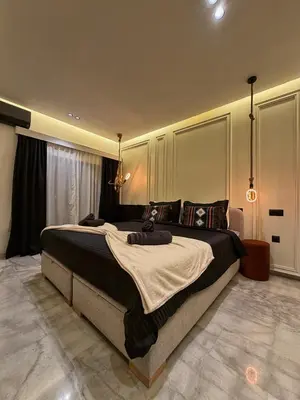 a bedroom with a large bed in a room at Luxury Serenity Marrakech - Spacious Duplex with Pool in Marrakech
