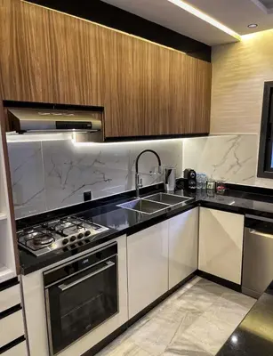 a kitchen with a sink and a stove at Luxury Serenity Marrakech - Spacious Duplex with Pool in Marrakech