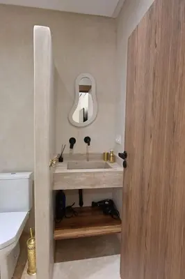a bathroom with a sink and a mirror at Suite Jasmin Elegance a Gueliz in Marrakech