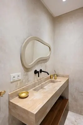 a bathroom with a sink and a mirror on the wall at Suite Ivoire - Elegance a Gueliz in Marrakech