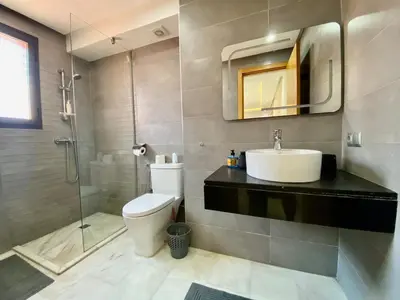 a bathroom with a toilet and a sink and a shower at Perfect pied-à-terre 1ch in Gueliz in Marrakech
