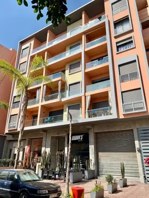 a building with a car parked in front of it at Perfect pied-à-terre 1ch in Gueliz in Marrakech