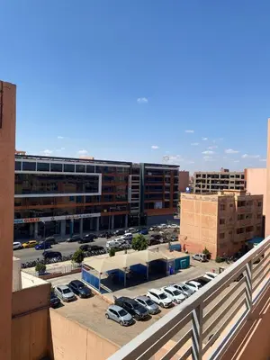 a view of a parking lot with cars in a parking lot at Perfect pied-à-terre 1ch in Gueliz in Marrakech