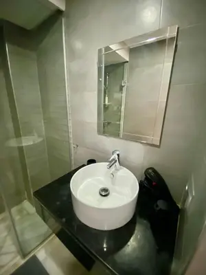 a bathroom with a sink and a mirror at Small 1-bedroom apartment perfect for discovering Marrakech in Marrakech