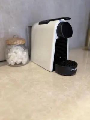 a toaster sitting on a counter next to a jar at Beautiful winter apartment with private hot tub in Marrakech