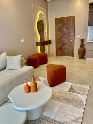 a living room with a couch and a table at Beautiful winter apartment with private hot tub in Marrakech