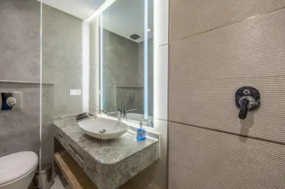 a bathroom with a sink and a toilet at City Center-1 Queen BR with AC, Pool and IPTV- Parking in Marrakech