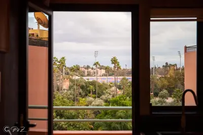 a window with a view of a race track at Sublime 2 bedroom apartment in Marrakech in Marrakech
