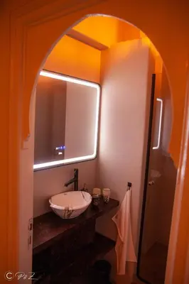 a bathroom with a sink and a mirror at Sublime 2 bedroom apartment in Marrakech in Marrakech